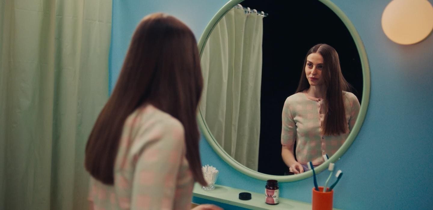 Image of a woman looking into a mirror